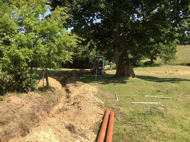 A long length of pipework on a farm near Dallington for a Sewage Treatment Plant