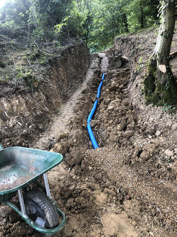 Some pipe being installed in the East Sussex woodland